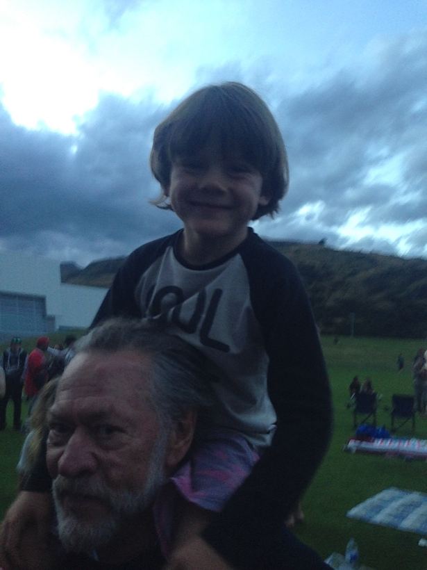 A shoulder ride at dusk